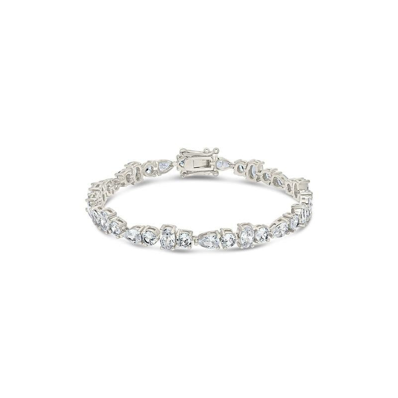 COMFORTH mixed shape tennis bracelet with round, oval, and pear cut crystal accents in a gold-tone finish.