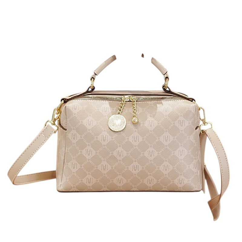COMFORTH monogram satchel handbag in beige faux leather with gold-tone hardware and detachable strap.