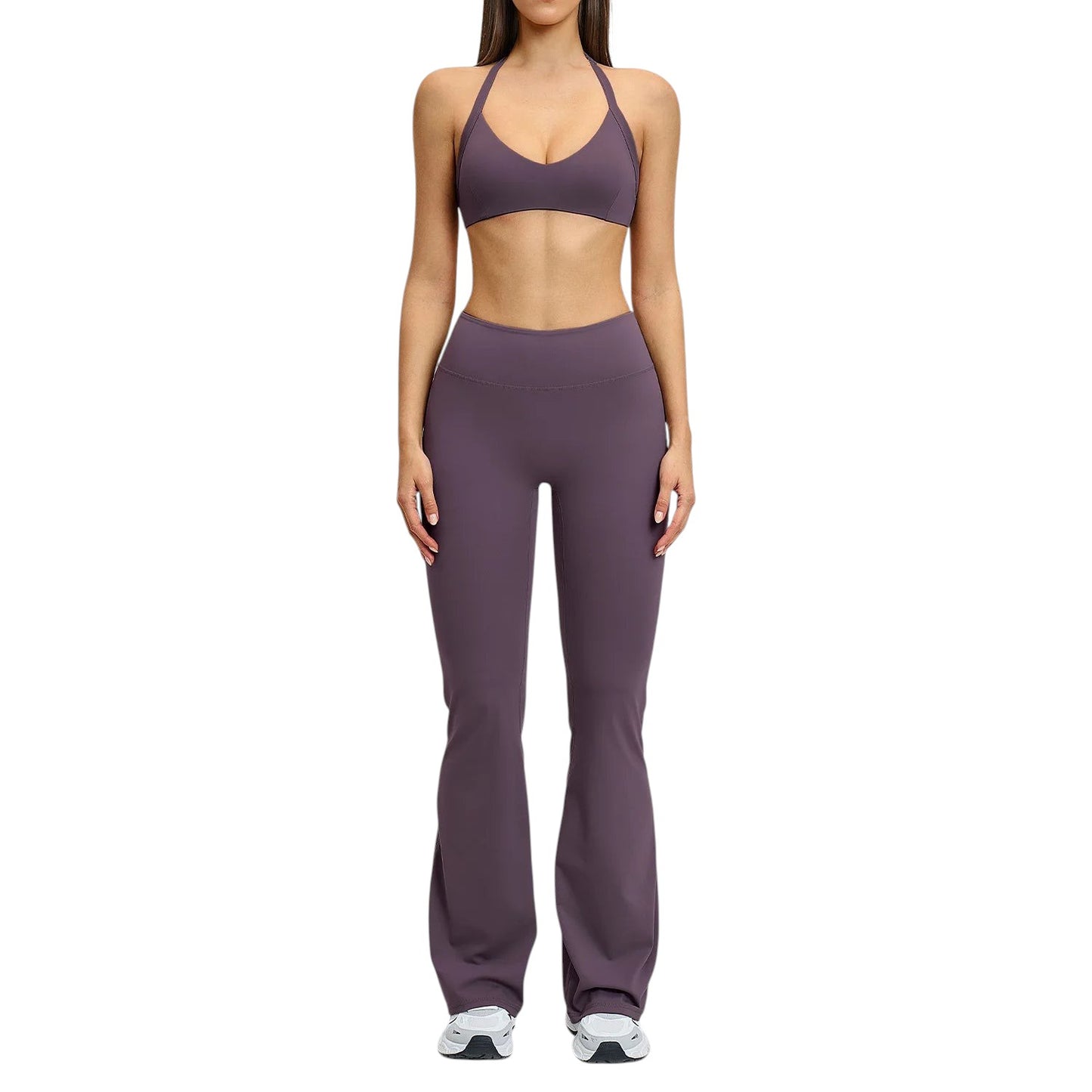 COMFORTHigh-waisted plum flare yoga pants with a comfortable, stretchy fabric blend. Model is wearing a matching plum sports bra.