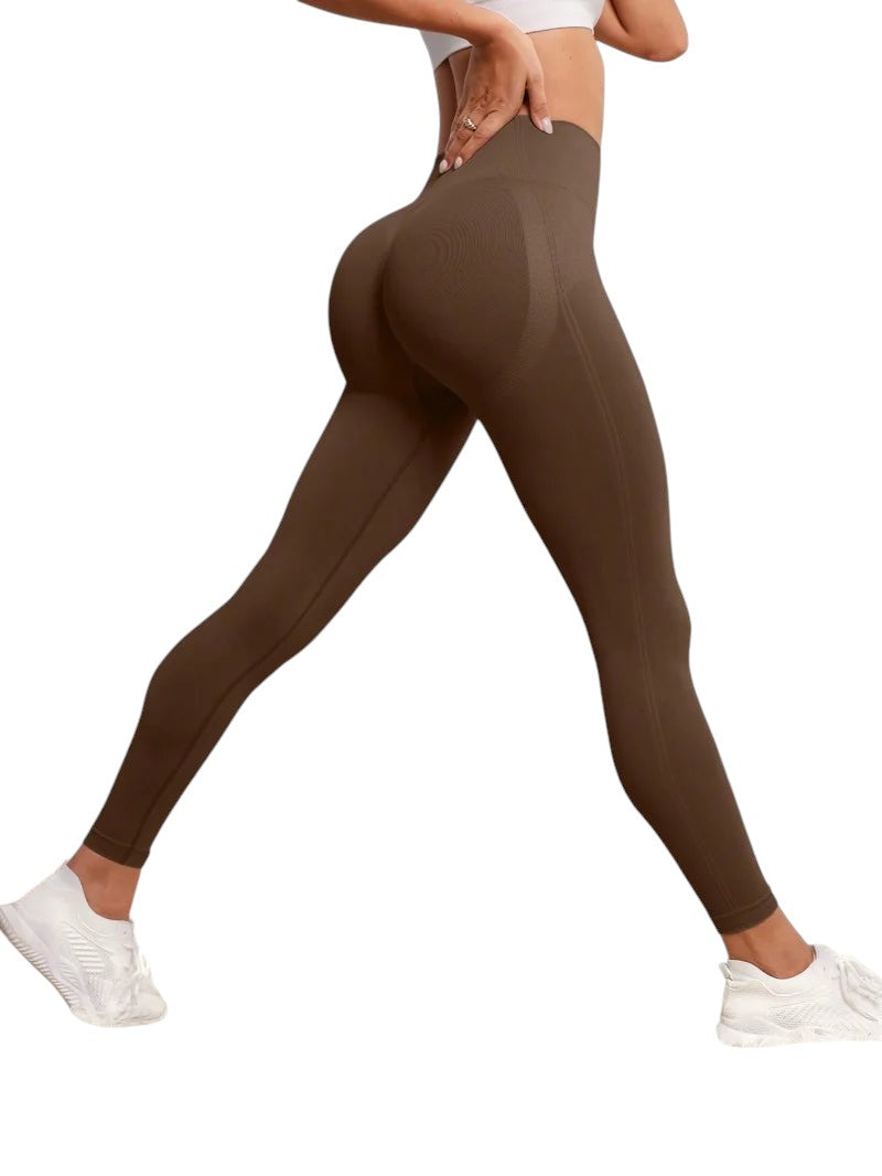 COMFORTH seamless high-waisted brown workout leggings with textured detail and flattering silhouette.
