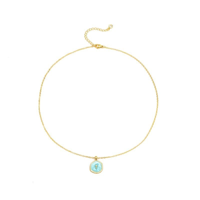 COMFORTH 14K gold plated necklace with a light blue irregular pendant featuring a subtle cross design. Adjustable chain.