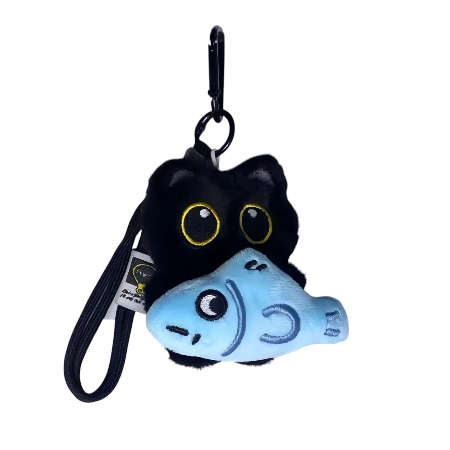 COMFORTH plush black cat charm with big yellow eyes holding a blue fish toy, attached to a keychain.