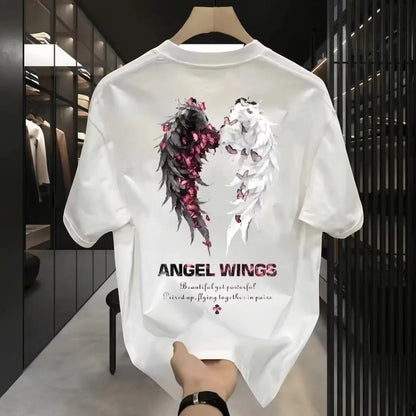 COMFORTH Angel Wings graphic t-shirt in white cotton with black and white wings design, accented with pink flowers and butterflies.
