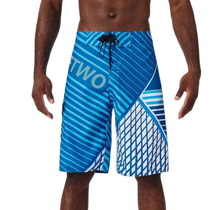 COMFORTH Men's blue athletic board shorts with white geometric and stripe patterns, drawstring waist.