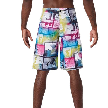 COMFORTH Men's athletic board shorts with a vibrant collage print of surfing scenes and palm trees in pink, blue, yellow, and white.
