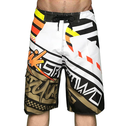COMFORTH Men's athletic board shorts with bold white, black, orange, and yellow graphic print. Quick-dry fabric.
