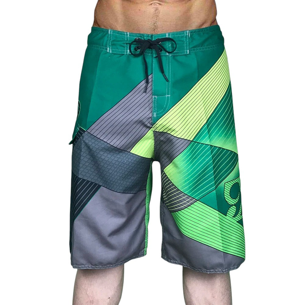 COMFORTH Men's athletic board shorts with green, grey, and lime green geometric pattern and drawstring closure.