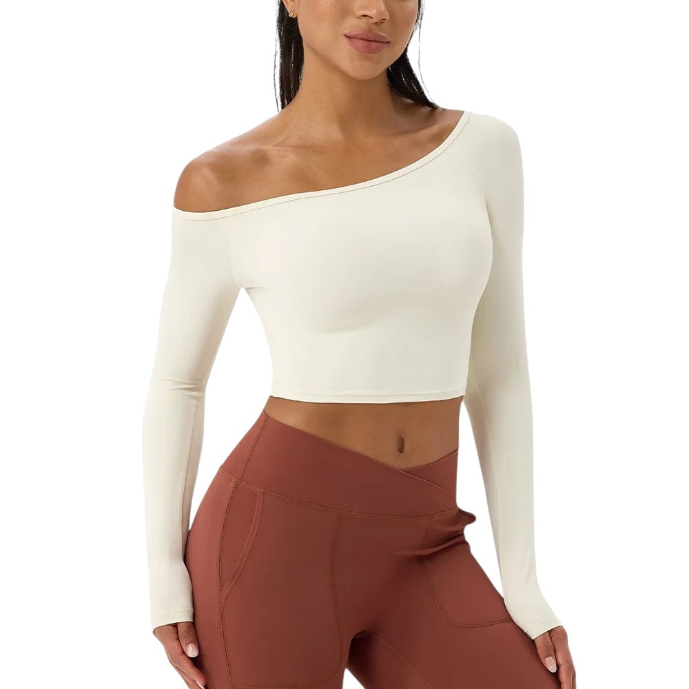 COMFORT cream athletic long sleeve crop top with asymmetrical neckline, 80% nylon, 20% spandex