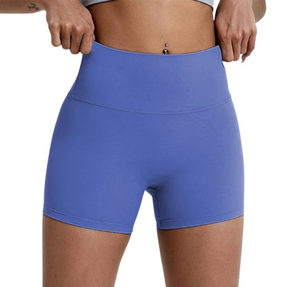 COMFORTHigh-waisted periwinkle athletic shorts with seamless construction and four-way stretch fabric.