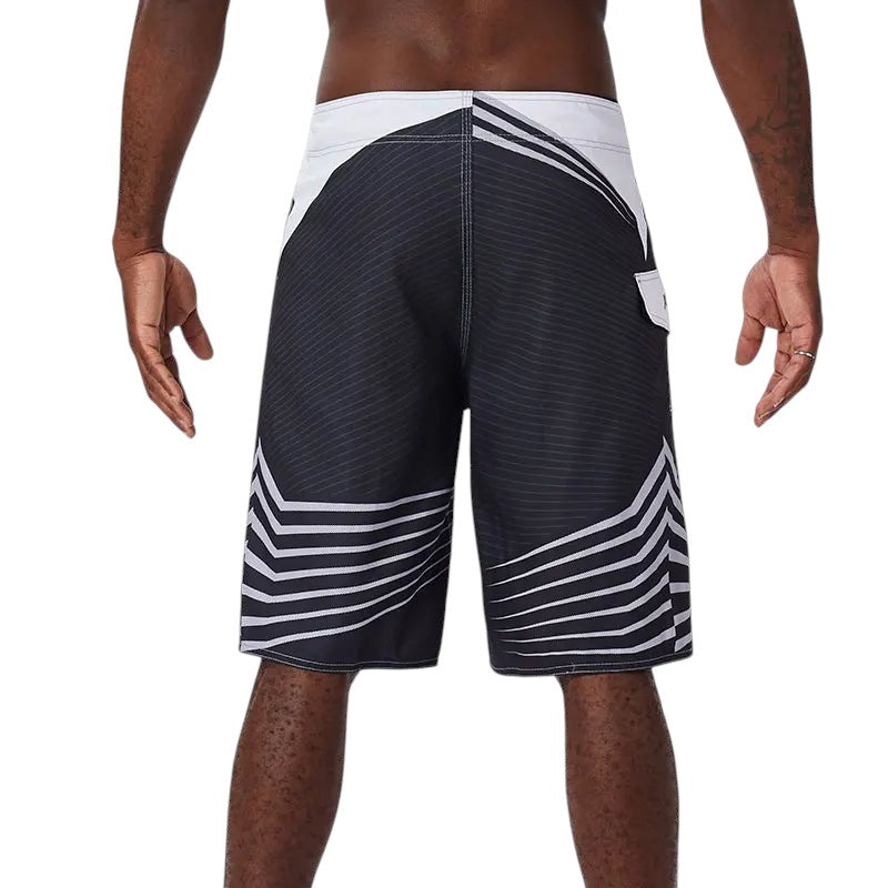 COMFORTH Men's black and white athletic striped board shorts with drawstring closure and quick-drying fabric.