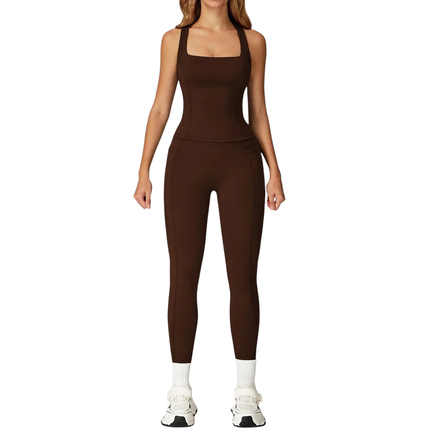 COMFORTH women's brown athletic two-piece set with halter neck sports bra and high-waisted flare leggings with V-waistband.