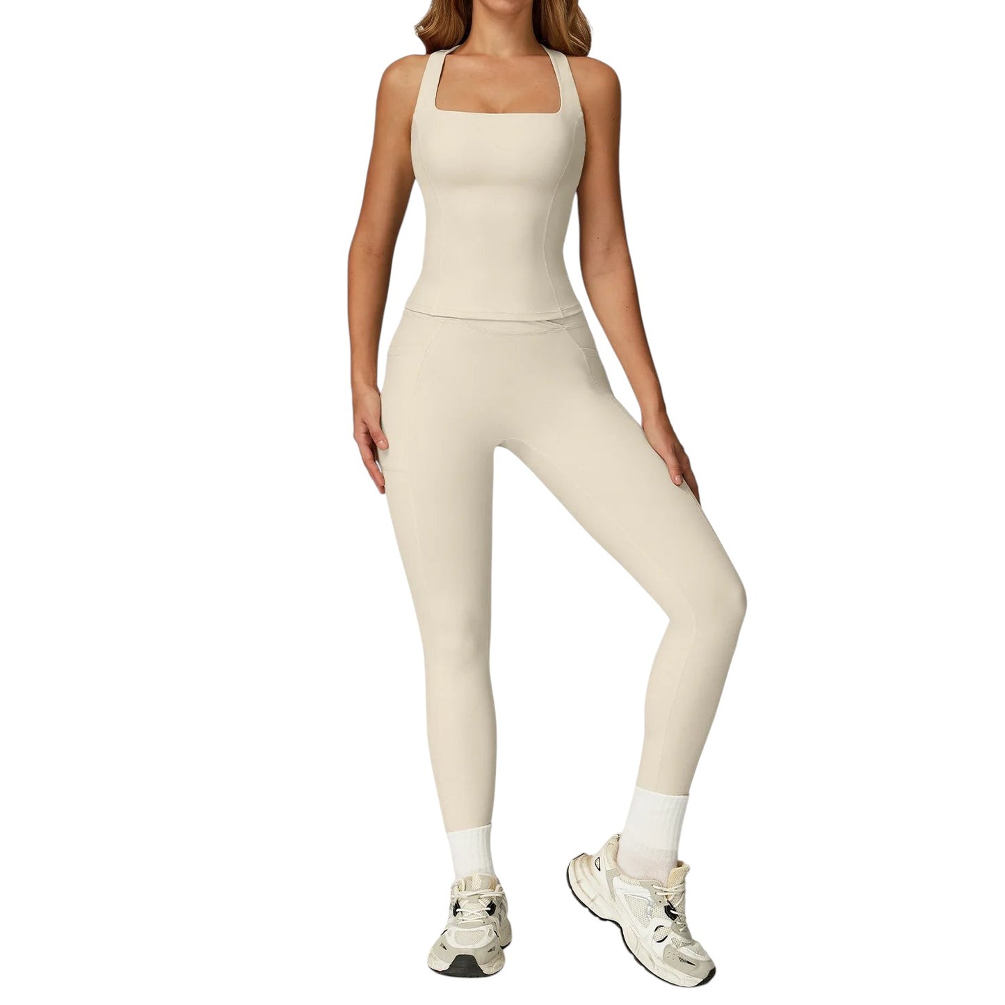 COMFORTH women's athletic two-piece set in cream, featuring a square-neck tank top and high-waisted flare leggings with V-waistband.