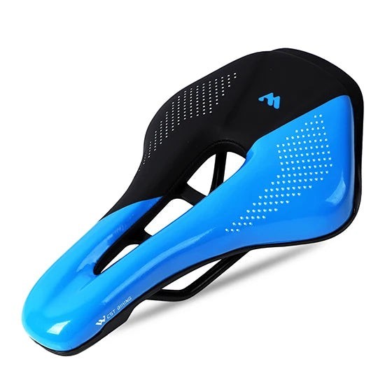 COMFORT bicycle saddle in blue and black with central channel and textured grip dots.