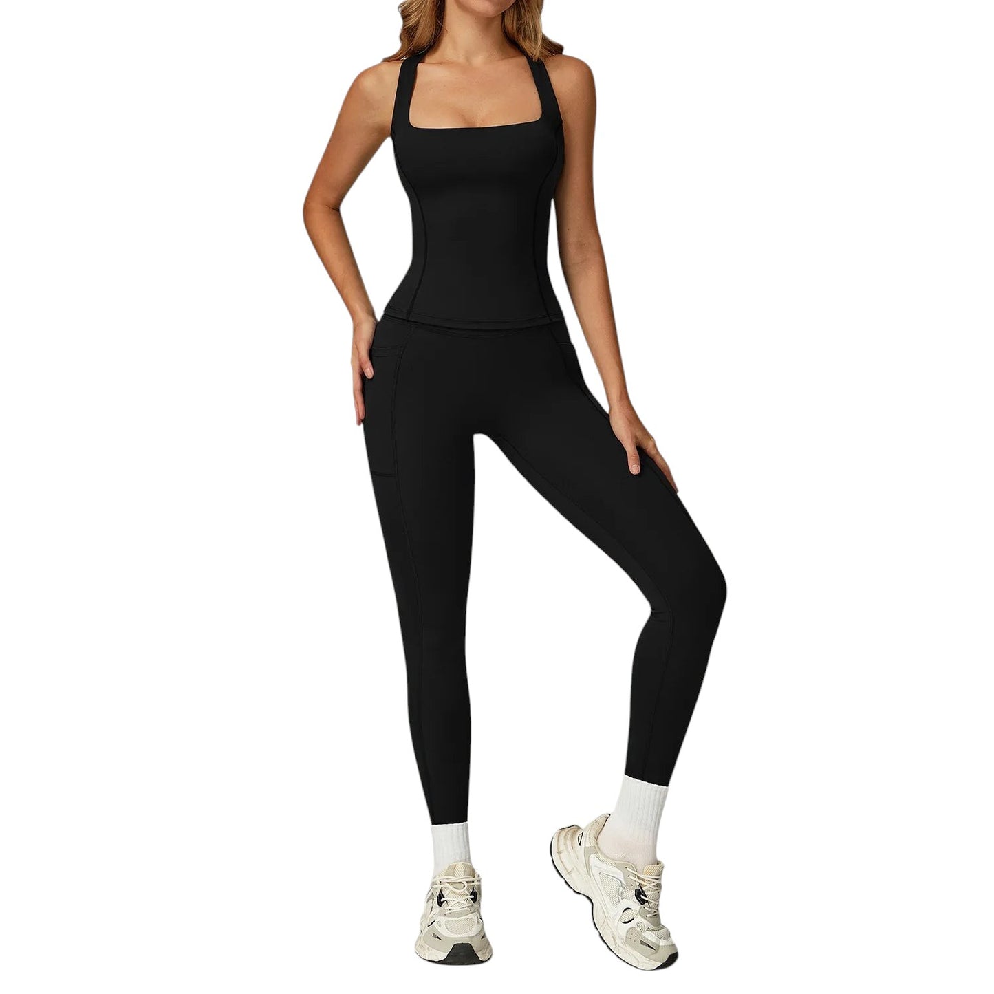 COMFORTH women's black athletic two-piece set with square-neck tank top and high-waisted flare leggings with pockets.