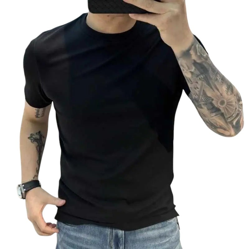 COMFORTS black short sleeve crew neck t-shirt made from soft-touch fabric. Model wears jeans and a watch.
