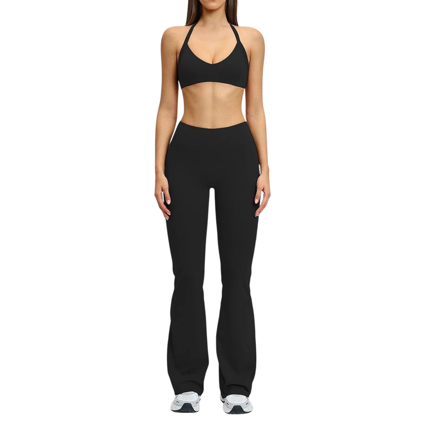 COMFORT black high-waisted flare yoga pants on a woman, made of stretchy fabric.