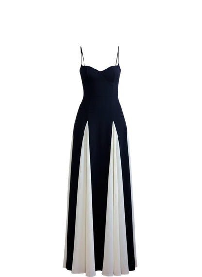 COMFORTH black and ivory evening gown with sweetheart neckline and flowing paneled skirt. Spaghetti straps.