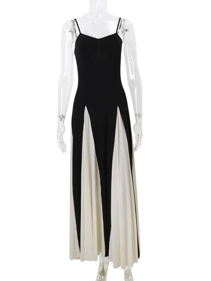 COMFORTH black and ivory evening gown with sweetheart neckline, spaghetti straps, and flowing paneled skirt.