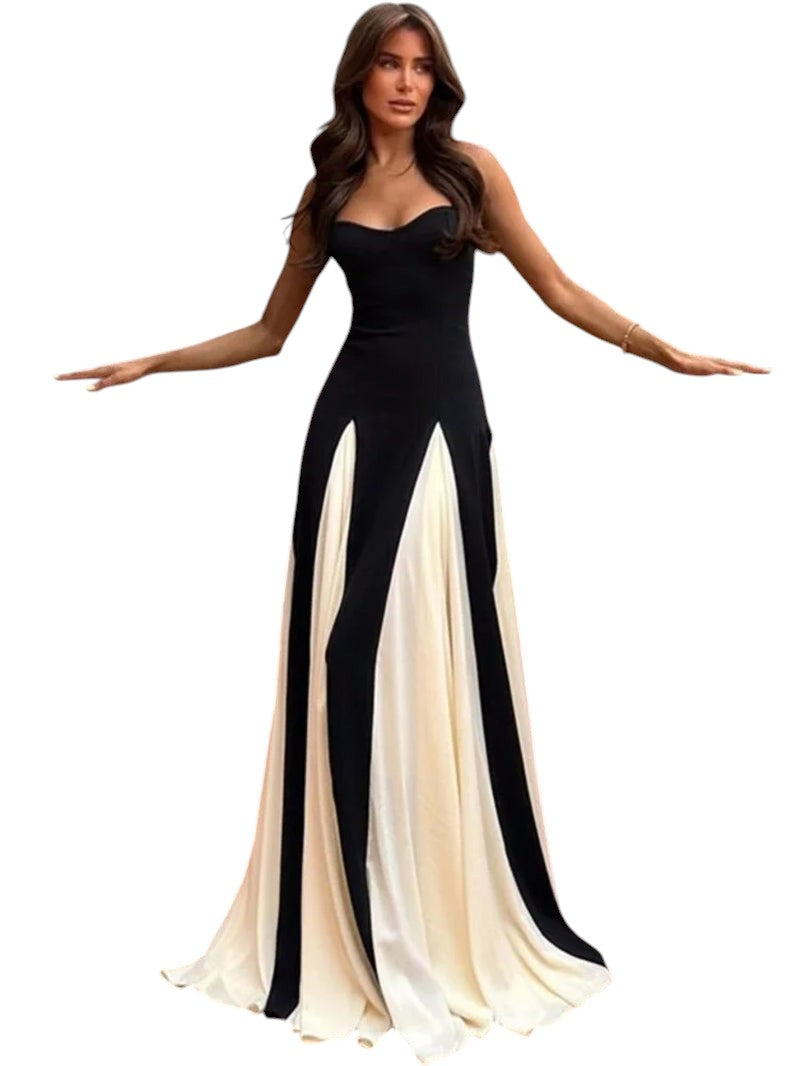 COMFORTH black and ivory evening gown with sweetheart neckline and flowing paneled skirt. Floor-length, spaghetti straps.