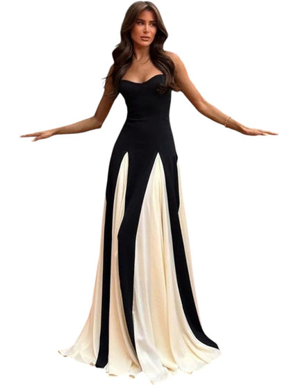 COMFORTH black and ivory evening gown with sweetheart neckline and flowing paneled skirt. Floor-length, spaghetti straps.