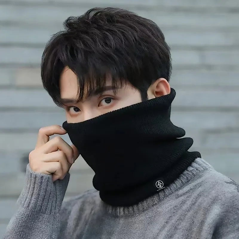 COMFORT black knit neck gaiter scarf with fleece lining, worn by a man in a grey sweater.