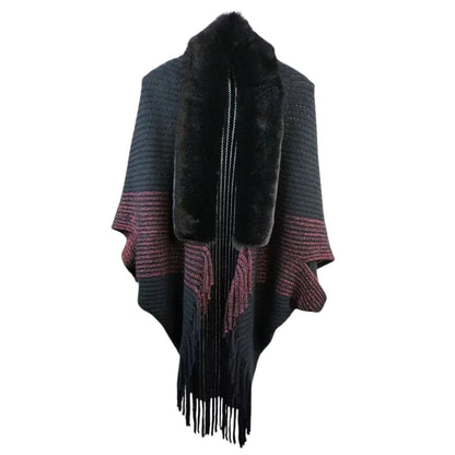 COMFORTH black knit poncho wrap with faux fur collar and burgundy metallic stripes, featuring fringe detail.