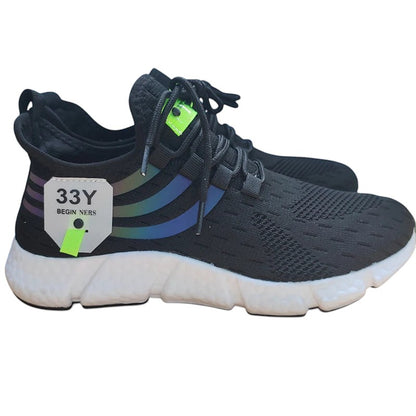 COMFORTH black mesh running sneakers with white cushioned sole and iridescent stripe accents.
