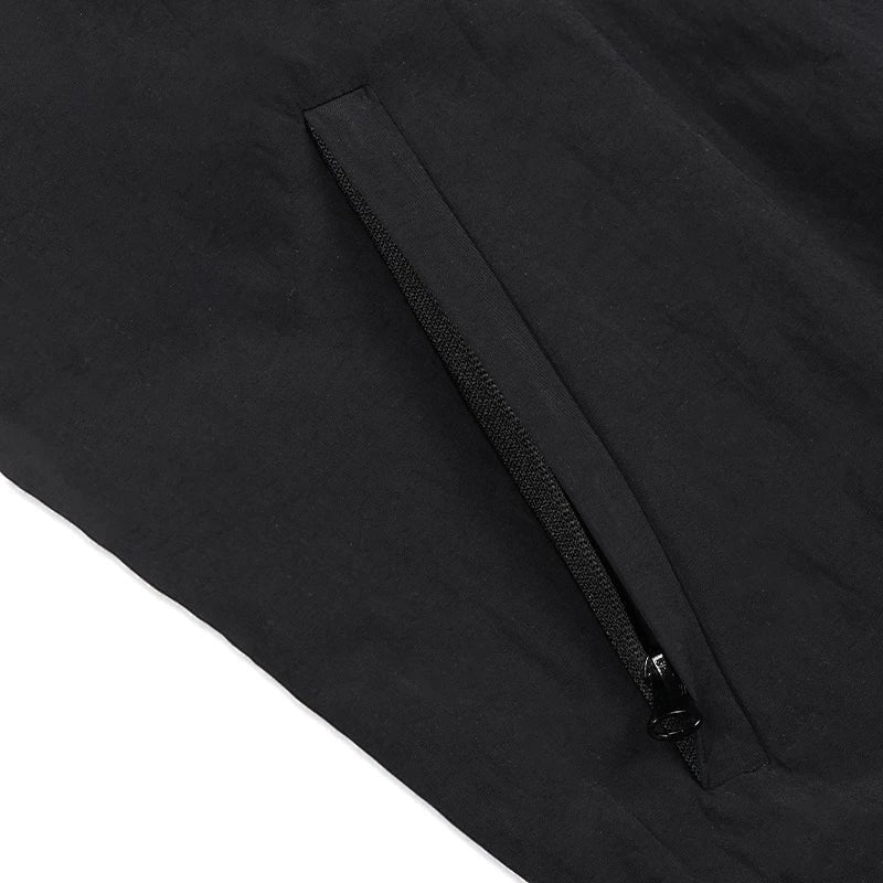 COMFORTH black MMA track jacket with white piping and zip pocket, ideal for training or casual wear.