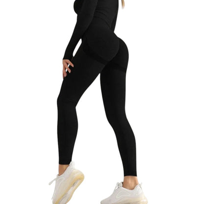 COMFORTH black seamless high-waisted workout leggings with textured detail and ribbed calves.