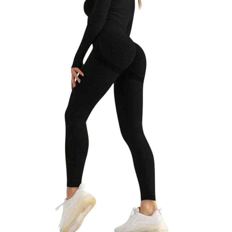 COMFORTHigh waisted black seamless workout leggings with textured detail and ribbed calves. Breathable fabric.