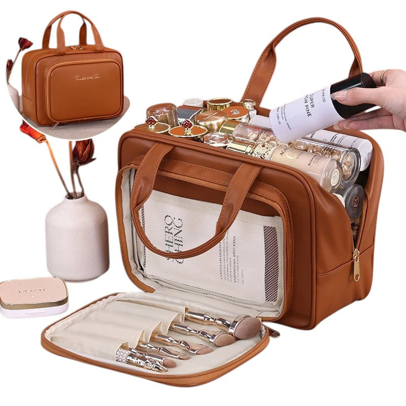 COMFORT brown PU leather travel makeup bag organizer with gold zipper and embroidered detail, holding cosmetics and brushes.