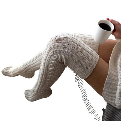COMFORTH cable knit thigh high socks in cream, perfect for cozy winter style and warmth.
