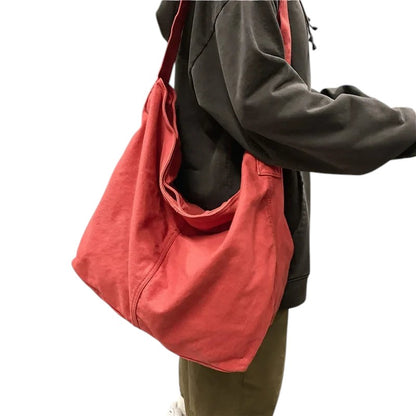 COMFORT coral red canvas shoulder tote bag with unstructured shape and comfortable strap.