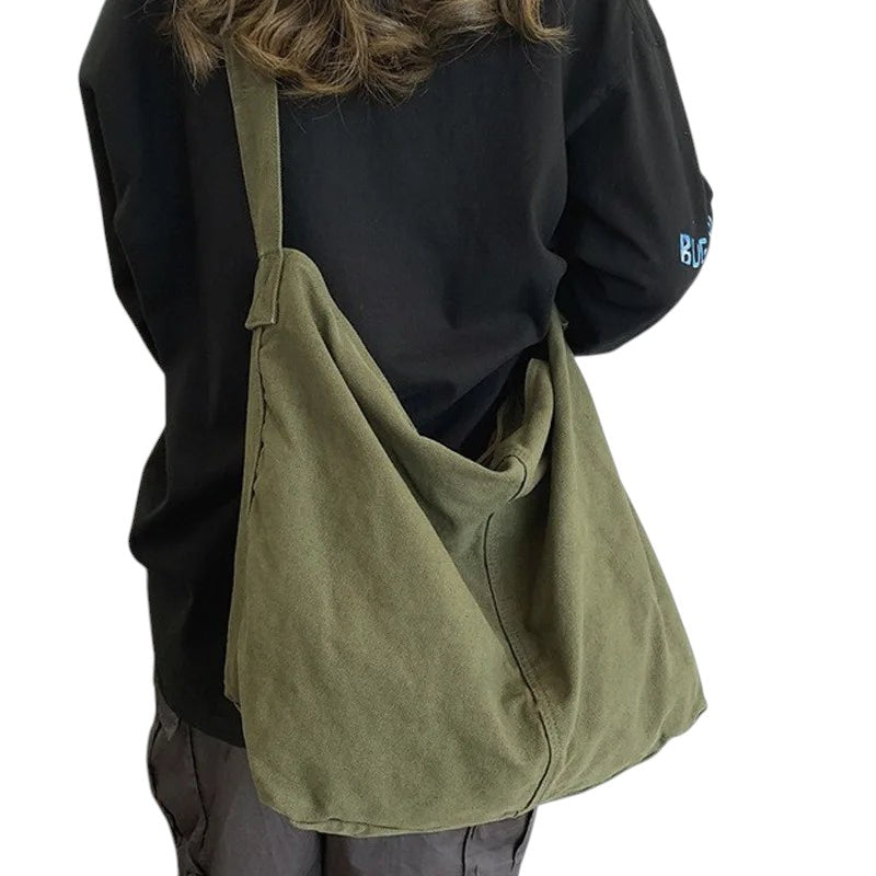 COMFORT green canvas shoulder tote bag with a relaxed silhouette and comfortable strap, perfect for everyday use.