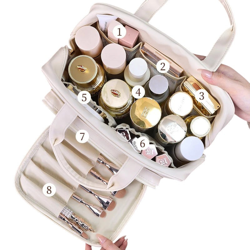 COMFORT cream PU leather travel makeup bag organizer with gold zipper, mesh dividers, and brush holder.