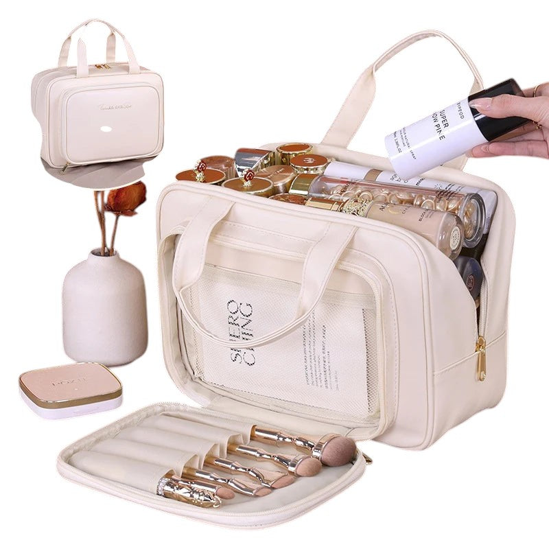 COMFORT cream PU leather travel makeup bag organizer with gold zipper and embroidered detail, holding cosmetics and brushes.