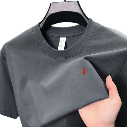 COMFORT crew neck short sleeve t-shirt in dark grey cotton blend with red embroidered logo on chest.