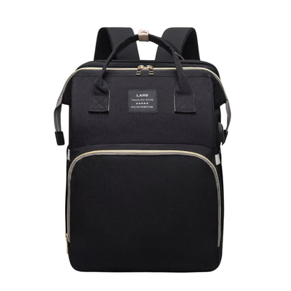 COMFORT black water-resistant diaper bag backpack with bassinet, multiple compartments and USB charging port.