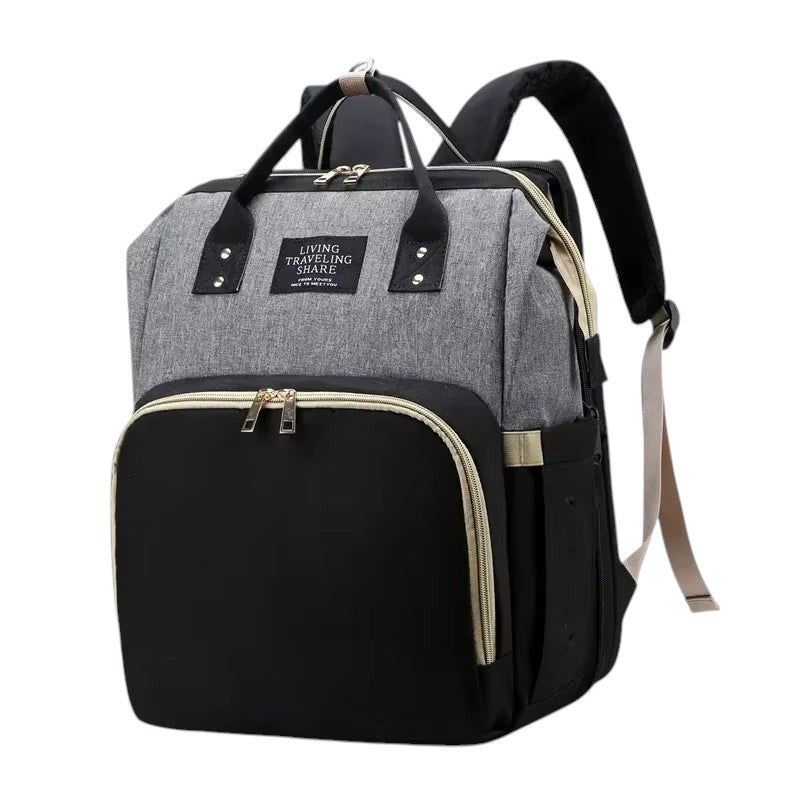 COMFORT grey and black diaper bag backpack with bassinet, water-resistant fabric, multiple compartments, and ergonomic straps.