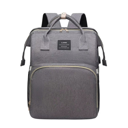 COMFORT grey fabric diaper bag backpack with bassinet, multiple compartments and insulated pockets.