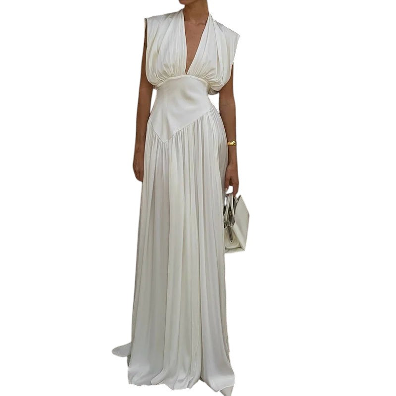 COMFORTH elegant ivory sleeveless deep V-neck maxi dress with flowing fabric and gathered bodice.