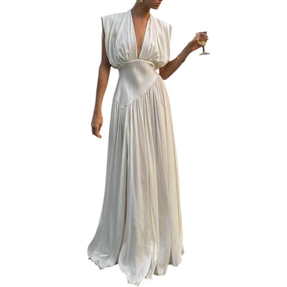 COMFORTH Elegant ivory sleeveless deep V-neck maxi dress with flowing fabric and gathered detailing.