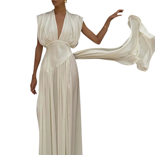 COMFORTH Elegant ivory sleeveless deep V-neck maxi dress with flowing fabric and pleated skirt.