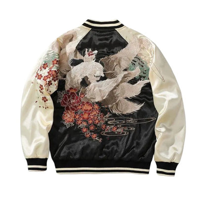 COMFORTH embroidered bomber jacket with floral and mythical creature design in black and cream satin-like fabric.