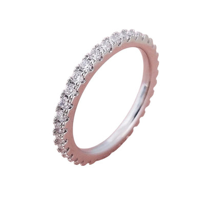 COMFORTHere sterling silver eternity band ring with cubic zirconia stones. Delicate and slim profile.