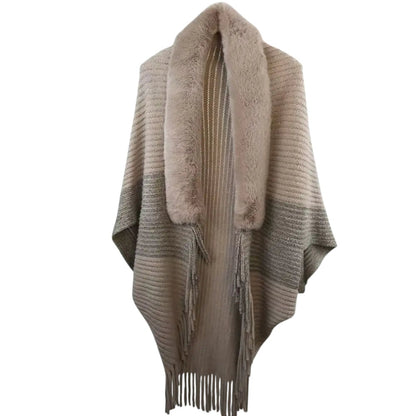 COMFORTH faux fur trimmed knit poncho wrap in beige with fringe detail and open front.