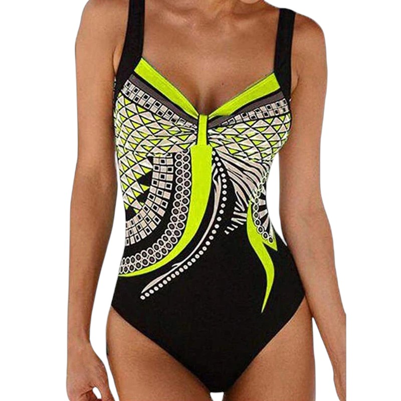 COMFORTS women's one-piece swimsuit with geometric print in black, neon green, white, and grey. Features adjustable straps and a flattering design.