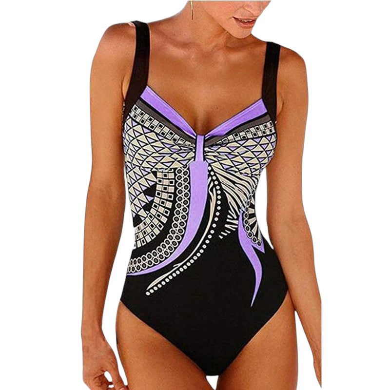 COMFORTH women's one-piece swimsuit with geometric print in black, purple, white, and beige. Features adjustable straps and a flattering design.