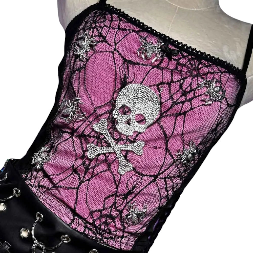 COMFORTHot pink lace corset top with black spider web overlay, rhinestone skull & crossbones, and spider accents. Black lace trim.