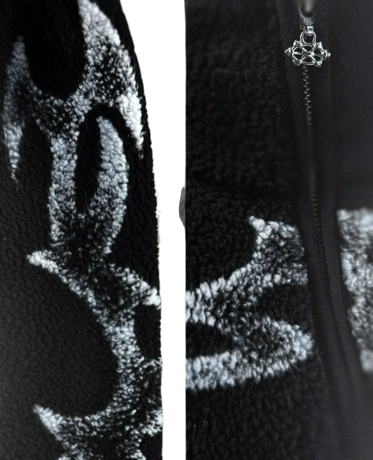 COMFORT black fleece jacket with white abstract graphic print and silver zipper detail.
